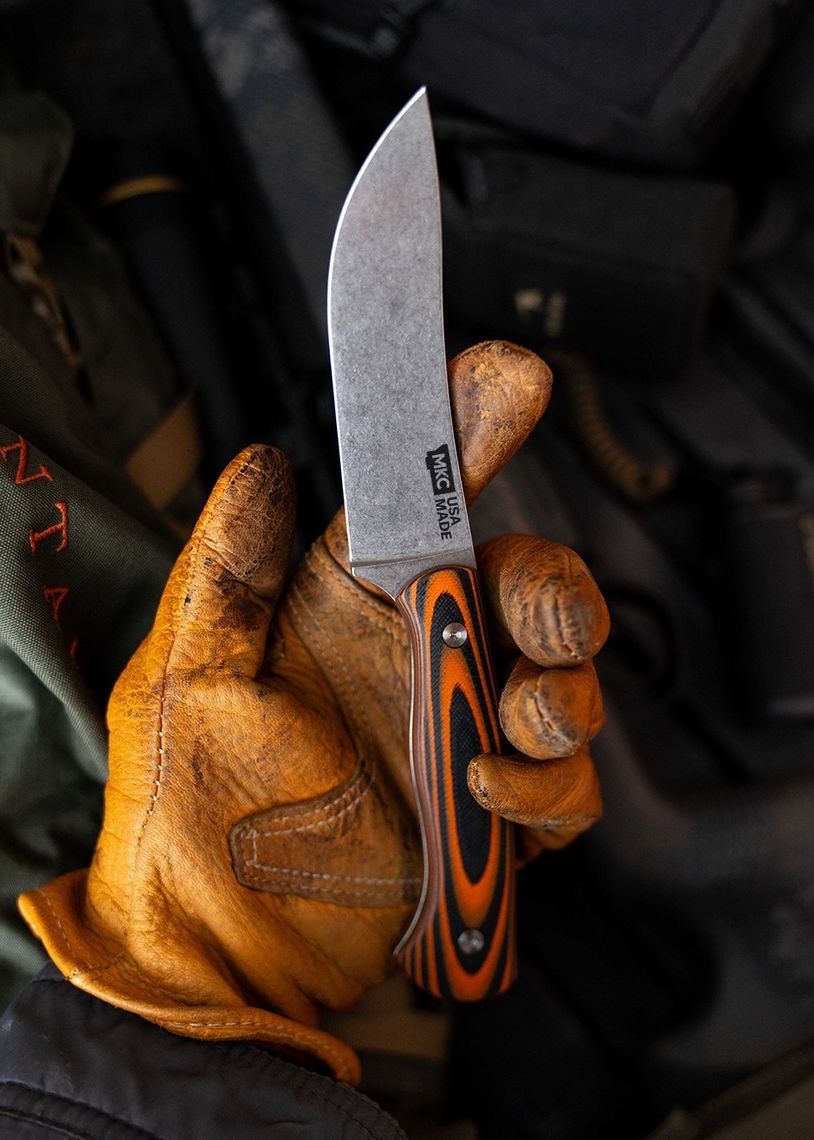 Product photography for Montana Knife Company featuring a knife resting in a work glove by TRUFFL branding agency